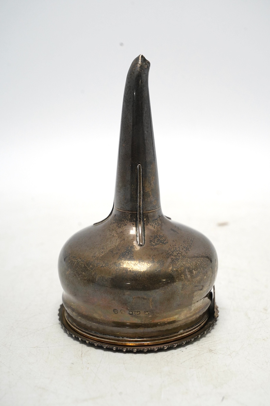A George IV silver wine funnel, maker's mark rubbed, London, 1823, 13.2cm, 4.7oz. Condition - fair